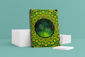 Starry Night Wellness Journal. The cover shows the aurora borealis in the night sky, surrounded by a mandala pattern