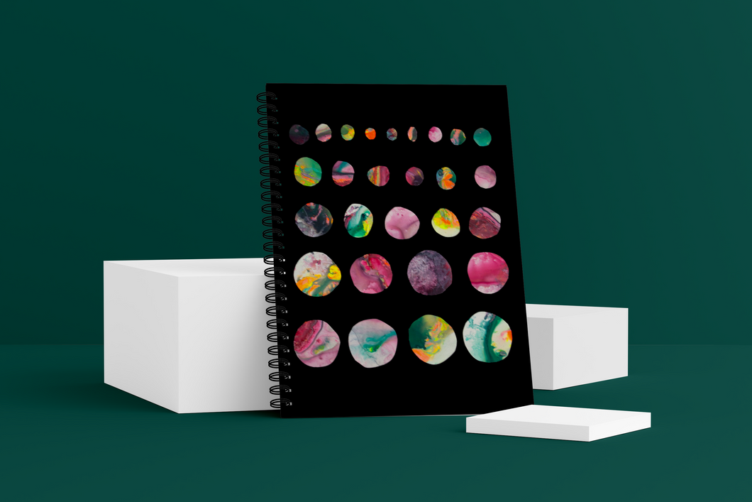 Moons Wellness Journal. The cover shows marble-like moons getting larger row by row